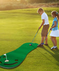 Two children using Indoor and Outdoor Golf Putting Practice Mat Set With 78 By 24 Inch Realistic Green on a golf course
