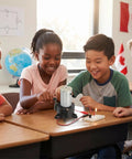 Children using Grab And Go Portable Hand Crank Generator For Emergency Power 5V To 24V 20W Dynamo in classroom setting