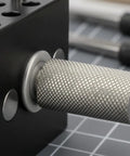 Close-up of the adjustable knob on the Compact Handheld Metal Vise With Multi Peg Holes For Precision Model Work And Desktop Clamping Projects, Durable Black Mini Bench Tool For Crafters.