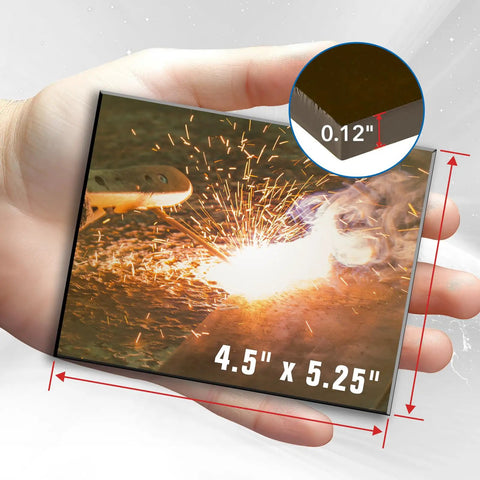 Person holding 4.5 by 5.25 inch welding glass lens pack of 2 hardened glass shield for helmets with sparks image