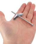Hand holding a heavy duty toggle bolt from the 24 Piece Toggle Bolts and Wing Nuts Set for Drywall Mounting, Iron Fastener