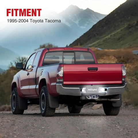 Rear view of a red Toyota Tacoma 1995-2004 with License Plate Lights For Toyota Tacoma 1995 1996 1997 1998 1999 2000 2001 2002 2003 2004 Black Housing 6000K White LED 2 Pack Non Polarity Plug And Play illuminated at dusk