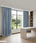 Electric Curtain Track With Retractable Motor For 7 To 17 Feet, Smart App Control And Manual Override, Auto Curtain Opener With Gentle Pull Activation, No Fuss Fit For I Rail And U Rail Systems, Ideal For Modern Smart Home Curtain Automation on blue drapes in a modern office room