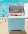 Massive 30L Electric Travel Cooler For Cars And Rvs 12V DC Portable Refrigerator by a swimming pool with drinks inside.