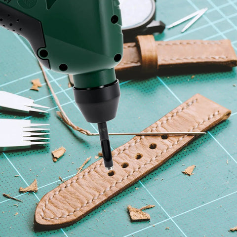 Close-up of Pro Grade Leather Hole Punch Tool Set with drill, crafting a brown leather belt with precision holes.