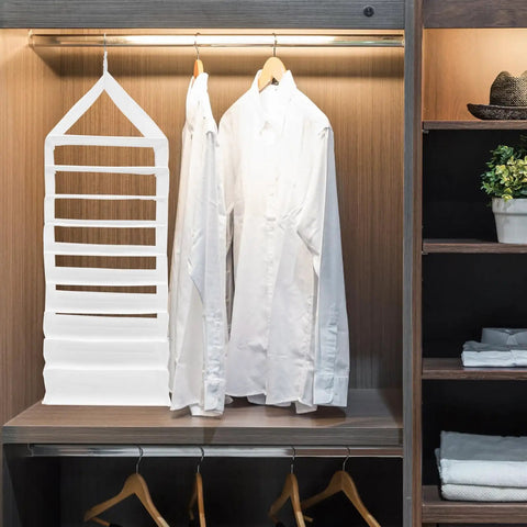 Hella Roomy White PVC Closet Hanging Storage Bag Featuring Nine Spacious Compartments To Keep Your Daily Threads And Weekend Fits Bangin And Fully Organized in a closet with white shirts.