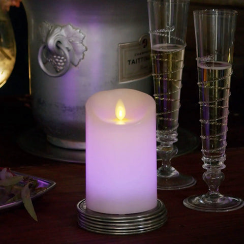 Flameless Color Changing LED Candle Pillar 3 By 4.5 Inches With Real Wax Moving Flame, Battery Operated With 18 Button Remote on table