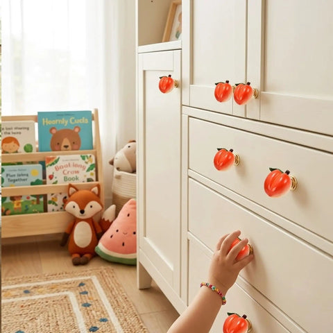Adorable 3D Peach Cabinet Knobs And Drawer Pulls For A Fresh Playful Home Vibe on white furniture with child's hand reaching.