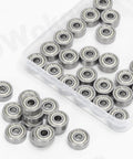 Top view of 72 high-carbon steel miniature ball bearings in a clear plastic case; six sizes.