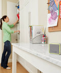 Portable Wireless Doorbell With Push Button, 350 Ft Range, gray finish, positioned on white countertop in family room