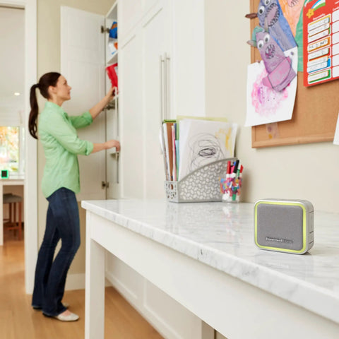 Portable Wireless Doorbell With Push Button, 350 Ft Range, gray finish, positioned on white countertop in family room
