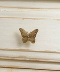 Close-up of 2 Pack Butterfly Cabinet Knobs In Gold Pewter with intricate details, perfect for girls room dresser vanity hardware.