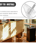 Close-up of 100 Pack Shelf Support Pegs For Cabinets And Shelves Heavy Duty Plastic DIY Brackets next to wooden cabinet
