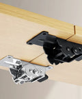 Rock Solid Self Locking Folding Hinges With 90 Degree Folding Leg Bracket Setup And Thick Steel Plates For Knockout Grit Plus No Nonsense Load Support In Classic Black, shown fixed under a wooden table.