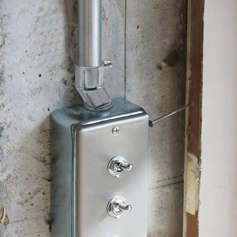Heavy Duty 6 Pack Offset Conduit Connectors 1/2 Inch Zinc Alloy attached to electrical outlet box for tight wiring jobs.