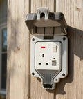 Heavy Duty Outdoor Electric Outlet With Dual Usb Ports And Rugged Flip Cover, Hella Weatherproof 13 Amp Wall Socket on wooden wall.