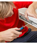 Installing Drawer Slide Rail System In Stainless Steel Side Mount Ball Bearing Slides on cabinetry with screwdriver.