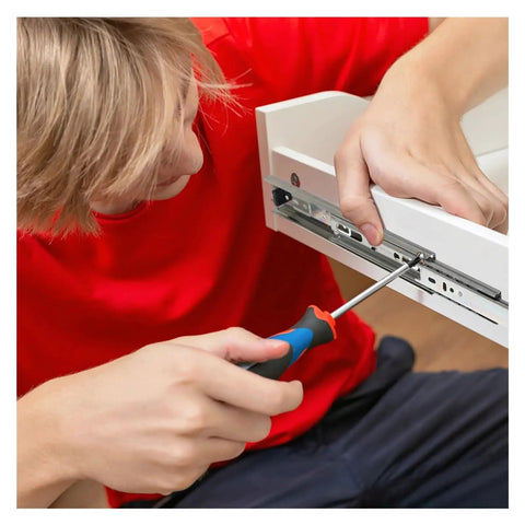 Installing Drawer Slide Rail System In Stainless Steel Side Mount Ball Bearing Slides on cabinetry with screwdriver.