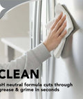 Person cleaning stainless steel appliance with Stainless Steel Cleaner And Polish Kit, 2 Pack With Anti Fingerprint Spray and Microfiber Cloths.