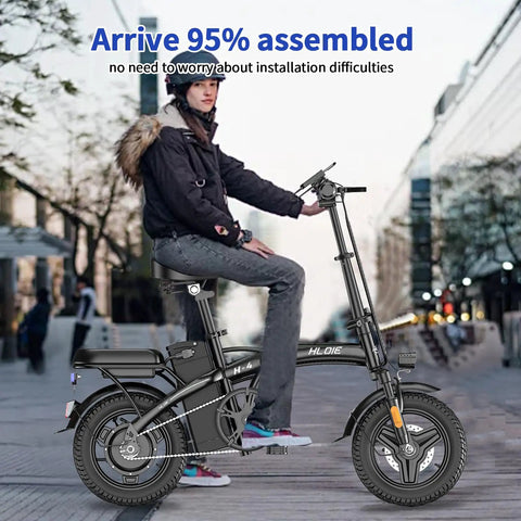 Person riding Folding Electric Bike For Adults And Teens, 750W Peak Motor, 14 inch foldable ebike in urban setting