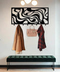 Sleek Abstract Wall Rack - Heavy Duty Modern Metal Hooks - Premium Key Holder And Coat Organizer - Smooth Home Storage Solution For Entryways - Crisp White Art Inspired Wall Decor - Real Deal Organization Game Changer For Daily Use featuring stylish black design with coats and a bag.