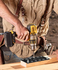 Carpenter using Aluminum Shelf Pin Drilling Jig For One Quarter Inch And Five Millimeter Holes on wooden board