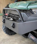 Heavy Duty 5500 Lb Electric Winch For Atv Utv With 12 Volt Motor mounted on front of ATV, featuring synthetic rope and remote control.