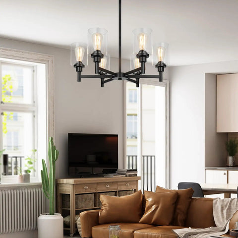 Black Farmhouse Chandelier With Six Clear Glass Shades Hanging Over Dining Table Featuring Sturdy Metal Frame And Sleek Modern Design That Hits Different For A Killer Centerpiece Vibe In Any Home Space in a modern living room.