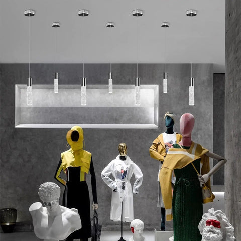 Upgrade Your Kitchen Or Bar With These Slick Chrome Led Bubble Crystal Pendant Lights Featuring Simple 3Cct Color Switches And Timeless Modern Designs Solid 3 Pack Gear For Effortless Ambient Glow in a stylish display above mannequins.