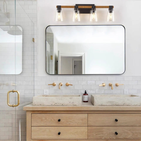 Farmhouse Style Four Light Vanity Light Over Mirror With Rustic Wood Frame And Seeded Glass Shades in bathroom setting