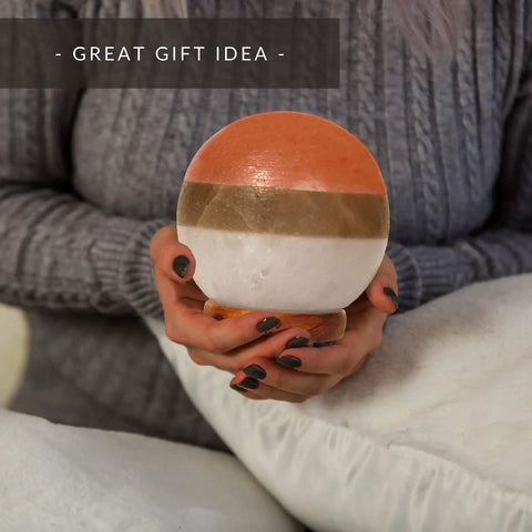 Person holding Dual Illumination Himalayan Salt Lamp Round Globe In Pink White Gray With Dimmable Adjustable Glow Night Light