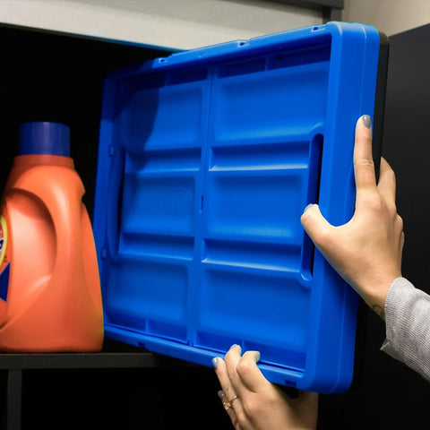 Person placing folded Collapsible Storage Bins 3 Pack 46L in Royal Blue on shelf beside detergent bottle.