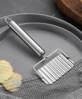 Two-piece stainless steel ripple potato slicer set with crinkle blade and handle.