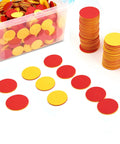 Two Sided Red And Yellow Counting Chips 1000 Piece Set in a clear container with stacked and scattered tiles for educational use.