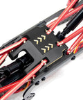 Close-up of Beefy Brass Chassis Frame Upgrade for 1x18 Scale TRX4M Crawler, featuring 60g skid plate, transmission mount