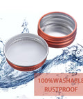 Bulk 270 Pack Orange Screw Top Aluminum Tin Jars 0.5 Oz 15 Ml With Tight Lids And Blank Labels, shown open near water.