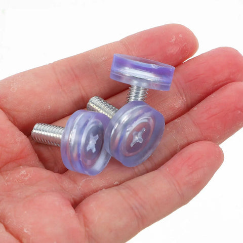 Adjustable Chair Leg Levelers With M6 Threads 40 Piece Set 18mm Diameter PVC non-slip glides shown in a hand for size reference