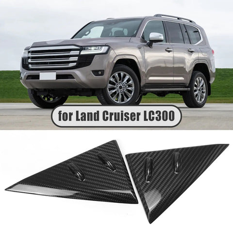 Dope Carbon Fiber Side Mirror Triangle Panel Trim For Land Cruiser J300 LC300 GX GXL VX Sahara ZX GR Sport 2022 To 2026 A Pillar Quarter Window Cover, Scratch Resistant, Ultra Lightweight 3K Weave Exterior Accent shown next to a Land Cruiser LC300