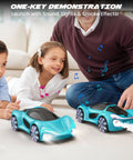 Children playing with Gesture Sensing Remote Control Car With Charging Dock 360 Degree Rotation Drift RC Stunt Toy 40 Minute Playtime Dual Control Spray Mist And LED Lights Dope Birthday Gift For Kids Boys And Girls Blue, featuring mist and LED effects, on indoor floor.