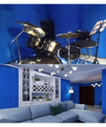Heavy Duty Self Adhesive Soundproofing Foam Sheet fitted in a home studio with drums and a living room, black acoustic insulation.