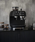 Top Shelf Semi Automatic Espresso Machine In Matte Black With Integrated Conical Burr Grinder And Adjustable Grind Settings on a kitchen counter.