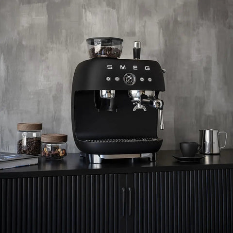 Top Shelf Semi Automatic Espresso Machine In Matte Black With Integrated Conical Burr Grinder And Adjustable Grind Settings on a kitchen counter.