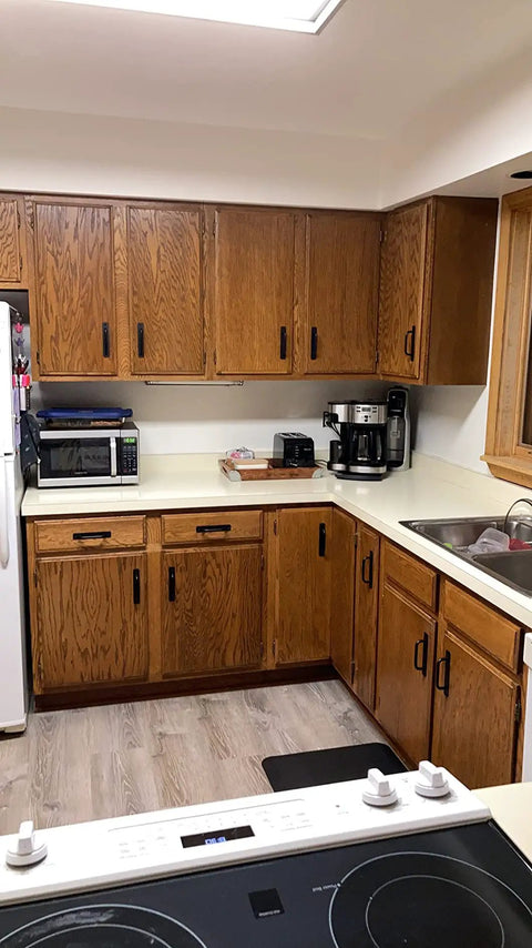 Kitchen with wood cabinets featuring 12 Pack Matte Black Cabinet Handles With Base Plate Aluminum Drawer Pulls For Cabinets.