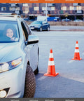 Car navigating around Six Pack 28 Inch Traffic Safety Cones With Reflective Collars For Road Safety Parking Lot And Driving Training