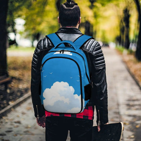 Free As A Bird Printed Unisex Backpack with large capacity worn by person outdoors, showing durable polyester material with cloud design.