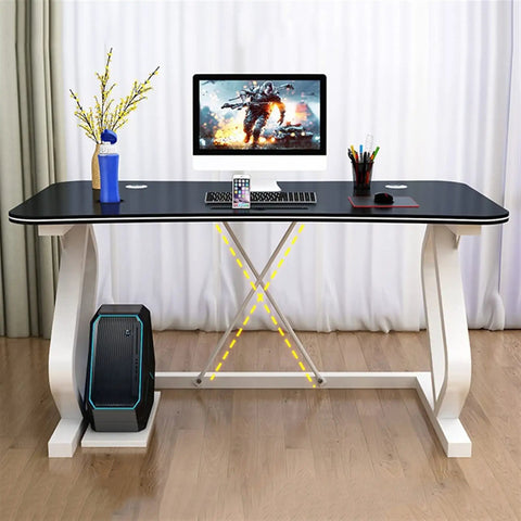 Modern White Gaming Desk Featuring A Built In Phone Slot And Side Storage Shelf, ergonomic layout, black surface with gaming setup