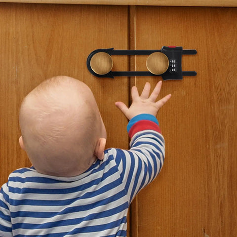 Four Pack Heavy Duty U Shape Cabinet Locks With Adjustable Password Latches Keep The Kiddos Out Of Drawers And Cupboards Adult Friendly No Fuss Safety Guards For Fridges And Closets Easy Install In Black on cabinets with a child reaching for them.