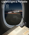 Rechargeable Clip On Reading Light With 14 LEDs, 3 Color Modes And 8 Brightness Levels attached to book, airplane window