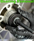 Wheel Bearing Puller Tool Kit For Harley Davidson Motorcycles in use to remove sealed bearings, heavy-duty repair.