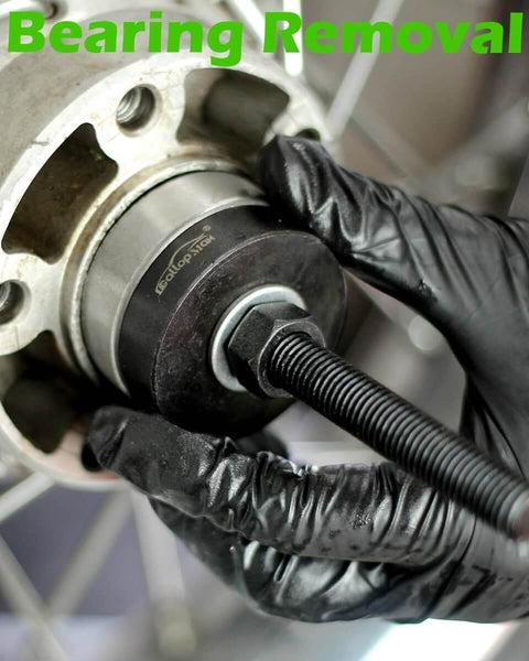 Wheel Bearing Puller Tool Kit For Harley Davidson Motorcycles in use to remove sealed bearings, heavy-duty repair.